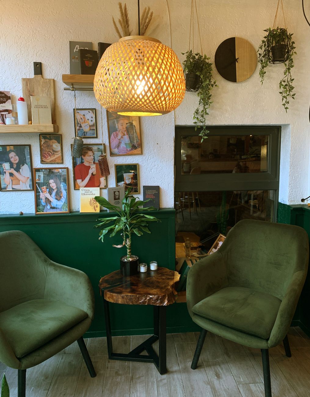 cozy indoor cafe with green decor and wooden details
