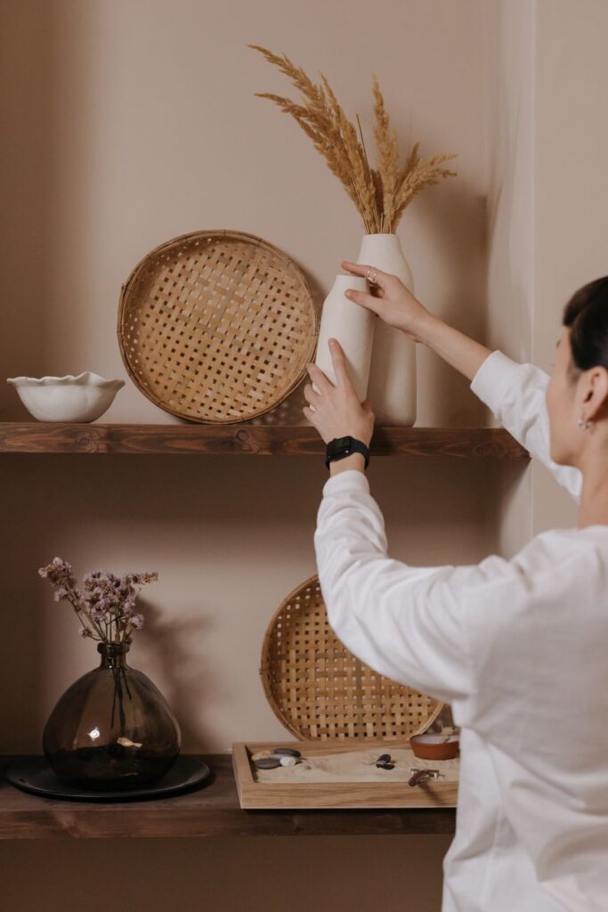 a man arranging decorations at home